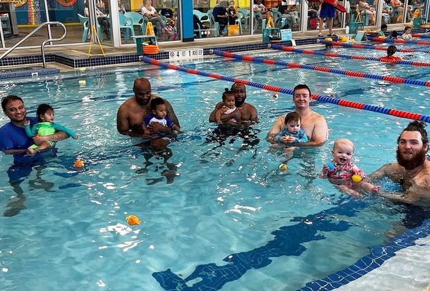 parents and babies in pool swim class