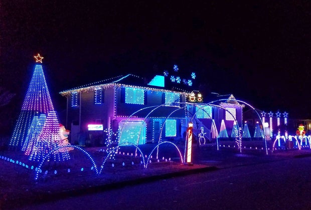 Photo of Connecticut house decked out in Christmas lights.