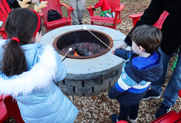 Visiting Santa's Christmas Tree Farm: Roasting marshmallows over the fire