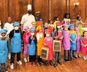 Kids get their own chef's hats and aprons during Maggiano's cooking classes. Photo courtesy of Maggiano's