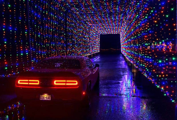 Car drives through the Tunnel fo Lights at the Magic of Lights Drive-thru