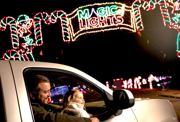 Girl and dad enjoy Magic of Lights Drive-thru