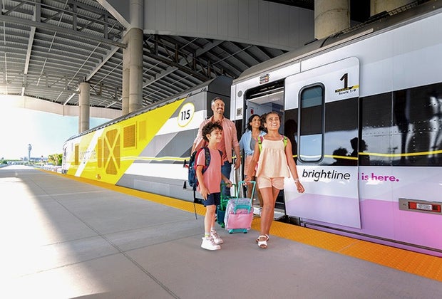Family baording the Brightline trainstation in Orlando