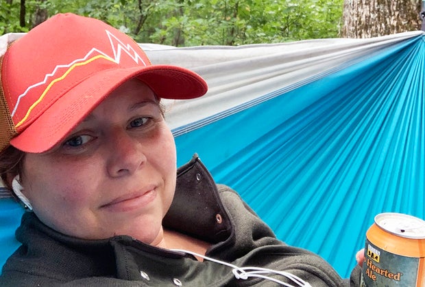 drinking a beer while relaxing in a hammock