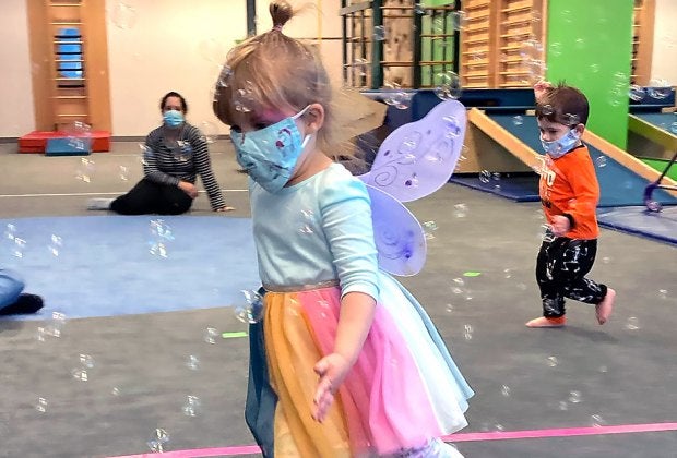 Kids play with bubbles at My Gym Westchester Open Now