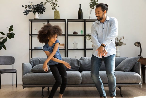Father and daughter dance in their living room: Holidays & Activities for June 2025 National Dance Day