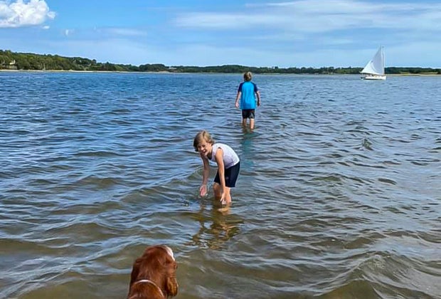 Image of family playing in water at Nauset Beach, Cape Cod.