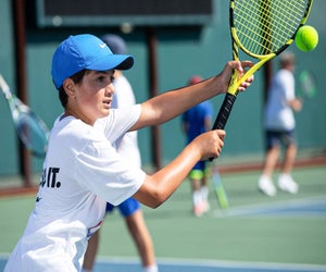 Kids can learn from top tennis coaches at Nike Tennis Camp. Photo courtesy of the camp