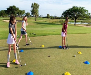 Introduce a beginner to the world of golf at To The Tee Golf's summer camp program. Photo courtesy of the club