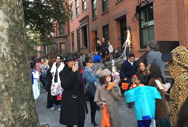 Trick-or-treaters on the street of Brooklyn