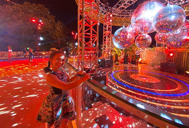 The DiscOasis in Central Park girl with disco balls