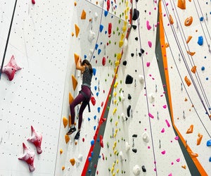 Active kids can hone their bouldering skills during summer camp at The Cliffs. Photo by Diana Kim