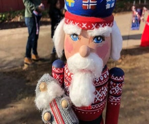 Enjoy the holiday carnival atmosphere in Mystic complete with stilt walkers, a brass band, and Santa's workshop. Photo courtesy of Olde Mistick Village