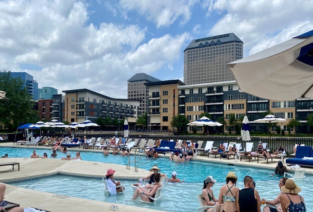 A picture of the Omni Las Colinas pool deck and Lake Caroyln