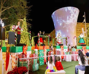 Lake Nona's holiday festival features fun activities for the whole family, including snowfalls, live shows, and entertainment. Photo courtesy of the festival