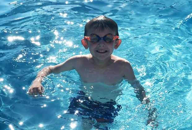 Best Orlando Pools with Day PassesL Boy swimming in pool