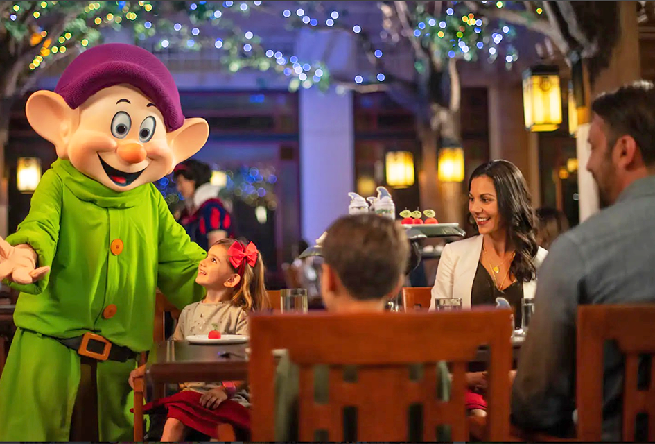 Celebrate your child’s birthday with Snow White, Dopey, and Grumpy at Story Book Dining at Artist Point. Photo courtesy of Disney