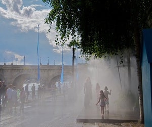 Let the kids cool down in Paris under the water sprays at Paris Plage. Photo by h2v via Flickr.