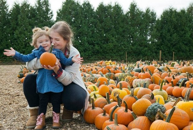 Photo of mother and child pumpkin picking in Boston.