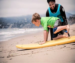 First conquor the sand, then the waves. Photo courtesy of Perfect Day Surf Camp