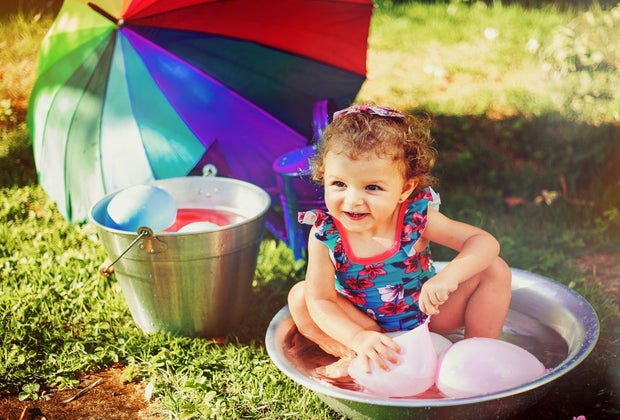 Sensory Activities for Toddlers, Infants, and Kids: Playing catch with Water Balloons