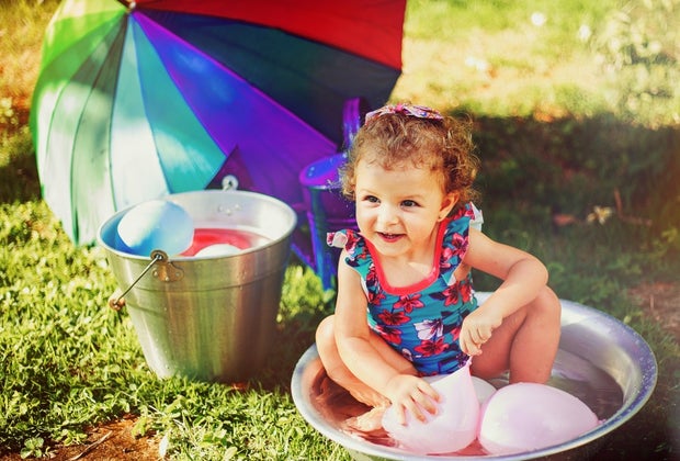 Sensory Activities for Toddlers, Infants, and Kids: Playing catch with Water Balloons