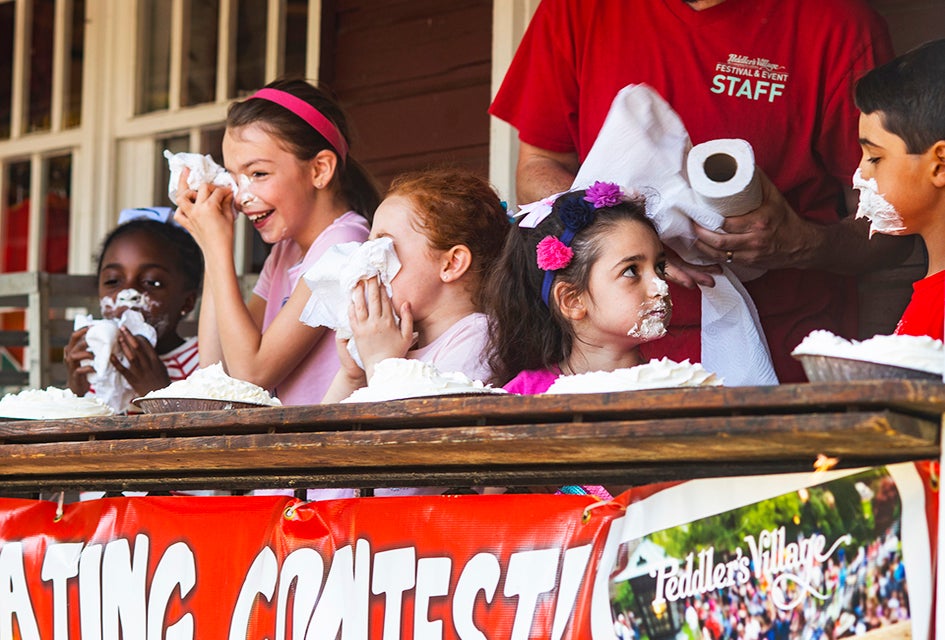 Enjoy live entertainment, family-friendly activities, and luscious strawberry-themed food and drink specials at Peddler's Village Strawberry Festival. Photo by Paul Boger