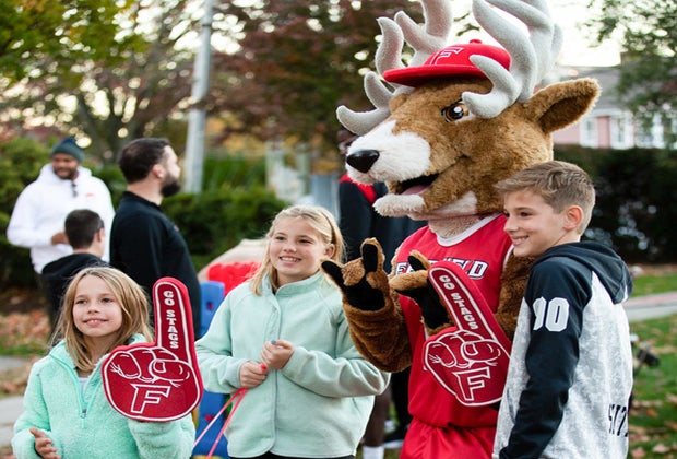 Image of kids with the Fairfield Stag mascot - College Sports in CT