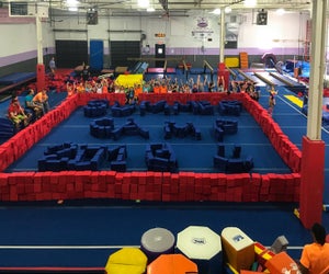Kids of all ages can learn and grow at these sports summer camps. Photo courtesy of New Era Gymnastics