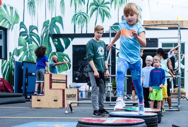 Image of children running a parkour obstacle course in Boston.