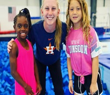 Two girls enjoying a fun gymnastics summer camp in Houston. Photo courtesy of the Houston Gymnastics Academy