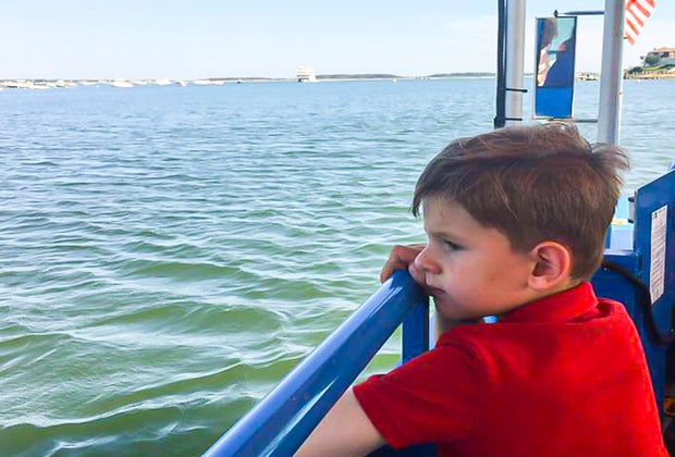 Photo of child on a Cape Cod boat- Budget Weekend Getaways