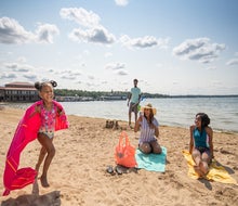 Little girl running on the beach. Photo courtesy of Visit Lake Geneva 