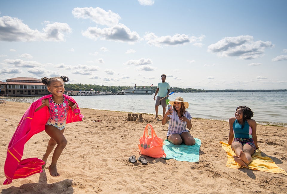 Little girl running on the beach. Photo courtesy of Visit Lake Geneva 