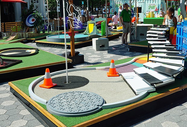 Pixar Putt little girl playing the Soul-themed hole