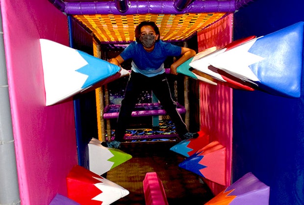 Boy in bounce house jungle gym