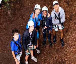 Harnesses and helmets spell treetop adventures at Pocono Springs Camp. Photo courtesy of the camp