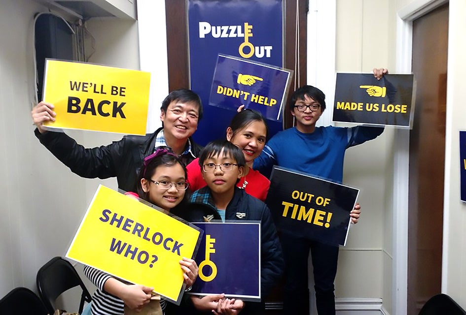 Work together to solve clues at Puzzle Out, one of our favorite family-friendly escape rooms in New Jersey. 