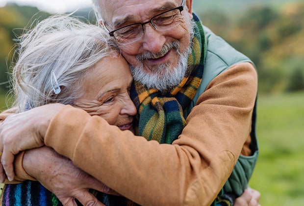 an older couple hugging 101 Questions To Ask Grandparents About Their Lives