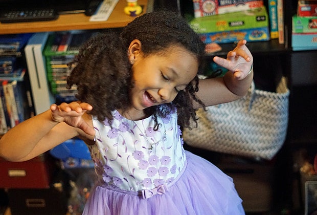 Little girl enjoys a dance break
