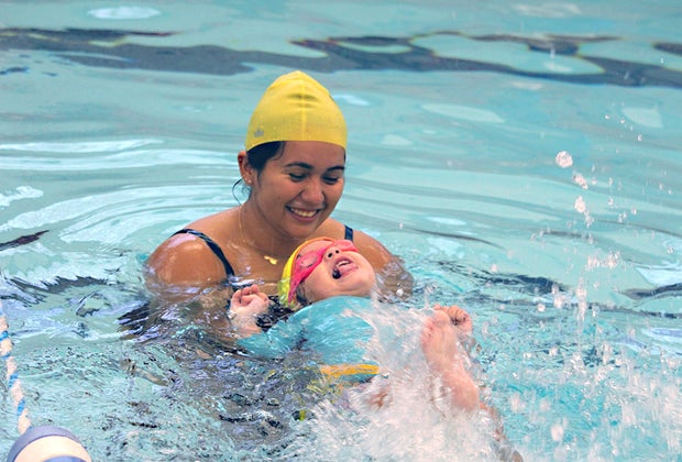 swim instructor in the pool with a toddler swim class
