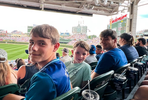 Chicago Cubs fans at Wrigley Field checking of things on their Chicago summer bucket list