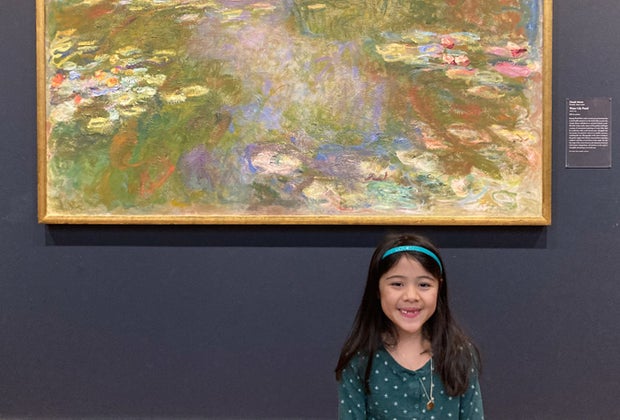 little girl standing in front of a Monet painting at the Institute of Art Chicago