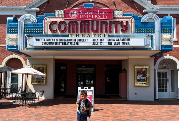 Photo of a child in front of Fairfield theatre - Train Rides for Connecticut Kids