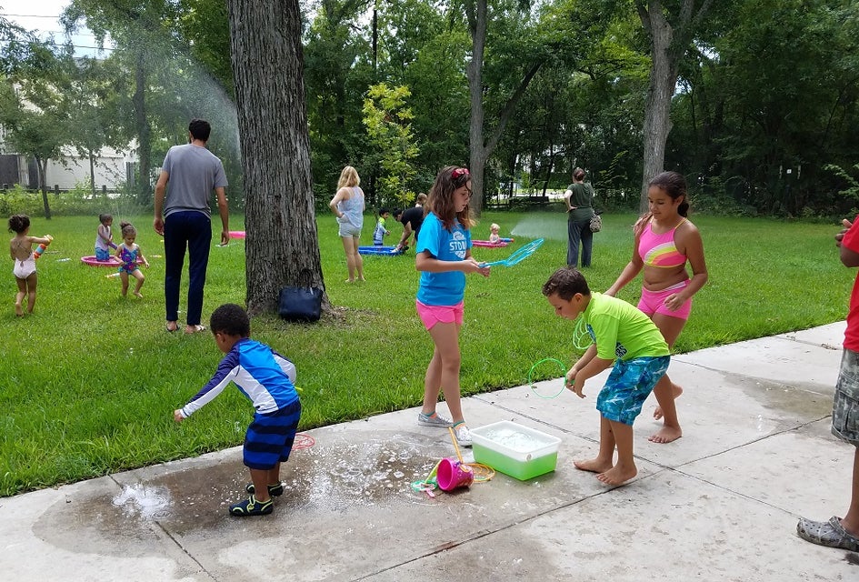 Kids can soak up a little extra fun in the sun during the Discovery Center's Sprinkler Day. Photo courtesy of Nature Discovery Center. 