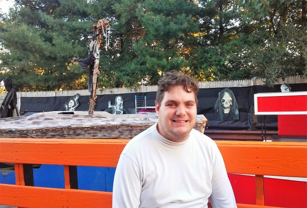 Man poses with Stew Leonard's Halloween display in Yonkers