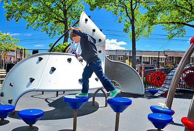 A top Queens playground, Paul Raimonda Playground offers sprinklers, climbing, and shady seating. Photo by author
