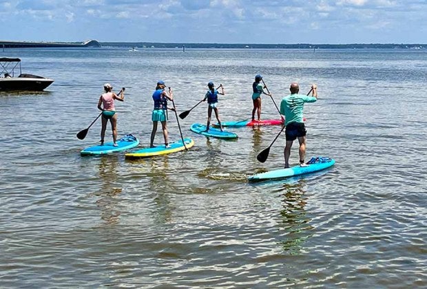 Paddleboarding is just one of many fun water activities in Destin. Photo by Jennifer Swope