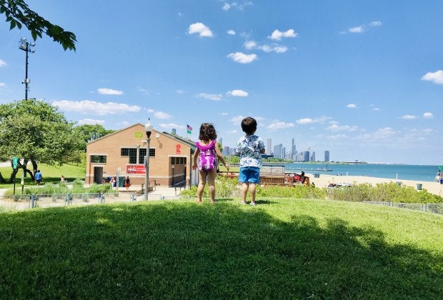 Two little Chicagoans, fresh from the splash pad at 31st Street Harbor, contemplate going to the beach.