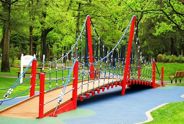 The climbing bridge at the LATCP playground at Eisenhower Park is a draw for kids of all ages. Photo courtesy of Let All The Children Play